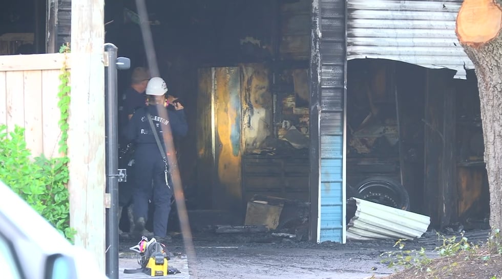 A Charleston auto body shop caught fire Friday morning.