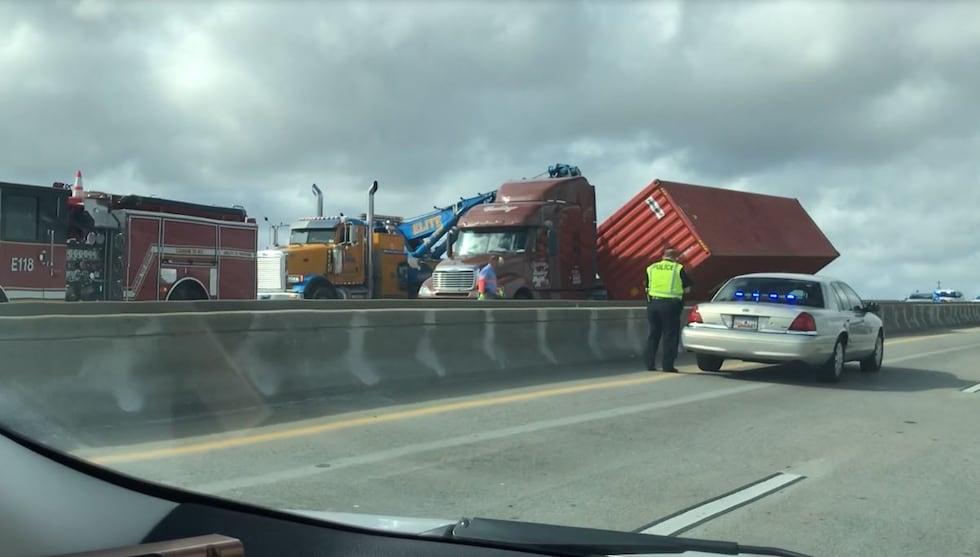 Heavy equipment was brought onto the eastbound side of the Wando Bridge to right the tipped...
