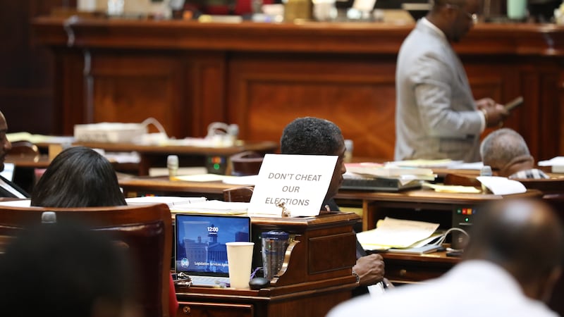 A sign sits on the desk of Democratic South Carolina Rep. Annie McDaniel during the House...
