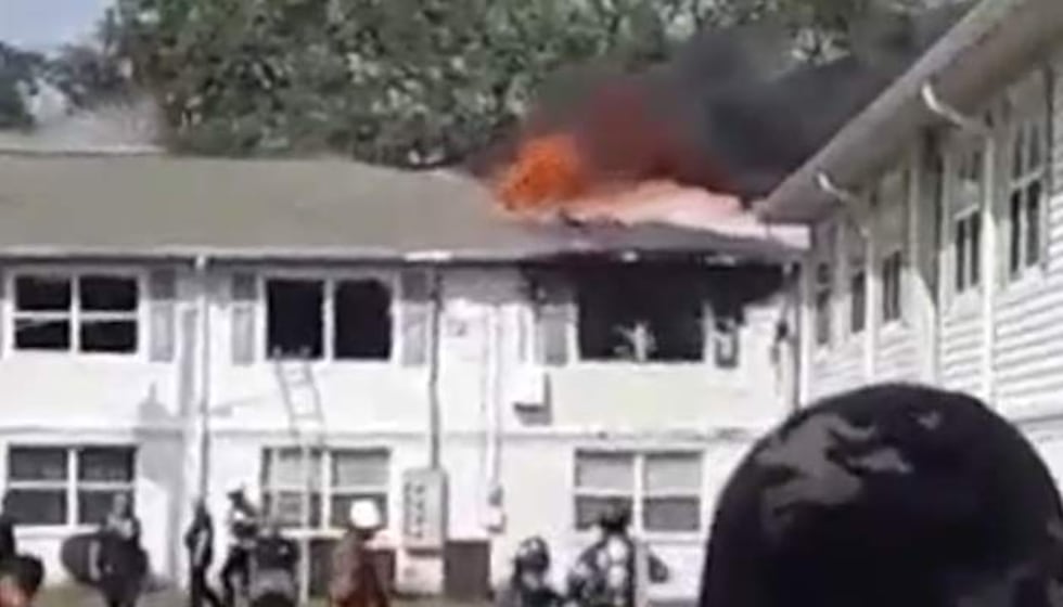 Witnesses reported large flames coming from the roof of one of the buildings.