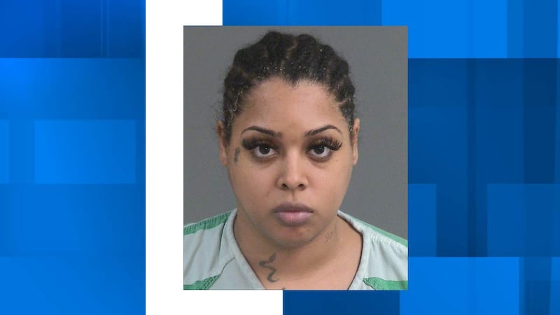 Gianni Desiree Hamilton is charged with passing a school bus with lights on, driving under...