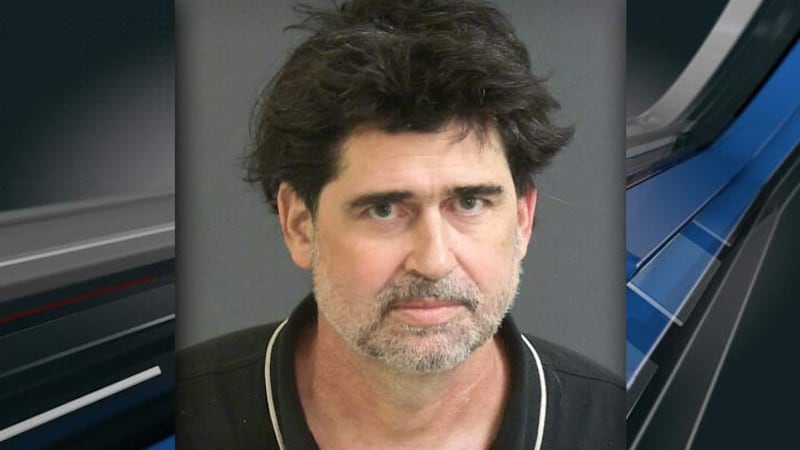 Brian Hooper is shown in a February booking photo.