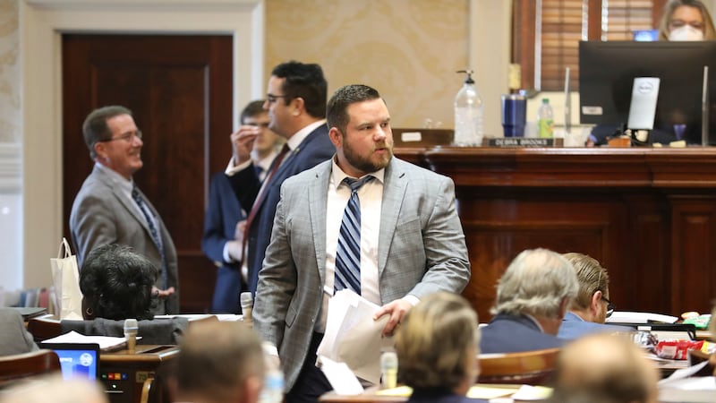 FILE - South Carolina Rep. RJ May, R-West Columbia, walks down the aisle of the House on...