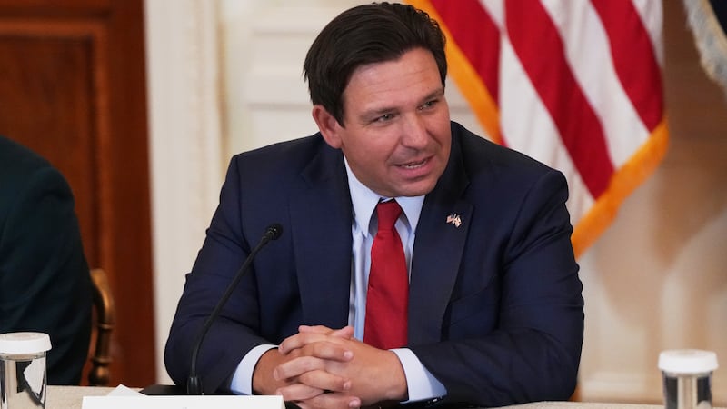 FILE - Florida Gov. Ron DeSantis speaks before a roundtable discussion on college sports in...