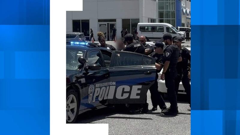A photo submitted shows multiple North Charleston Police officers placing a youth in a police...