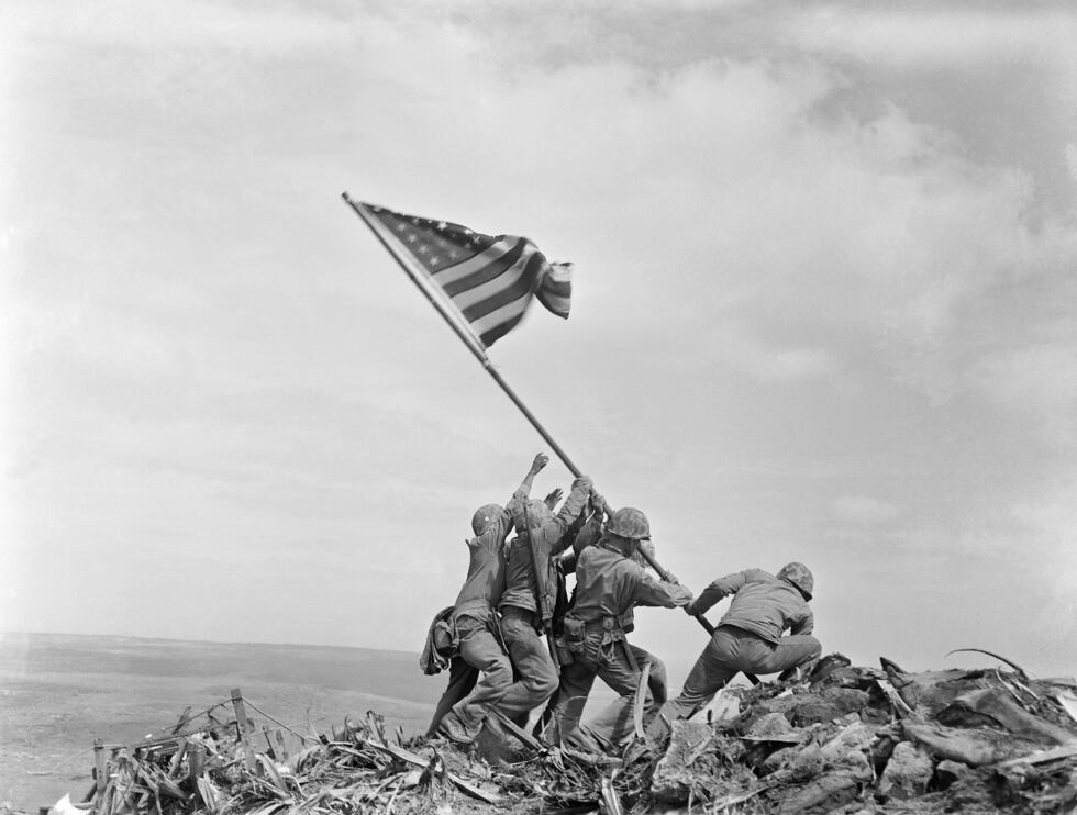 FILE - In this Feb 23, 1945 file photo, U.S. Marines of the 28th Regiment, 5th Division, raise...