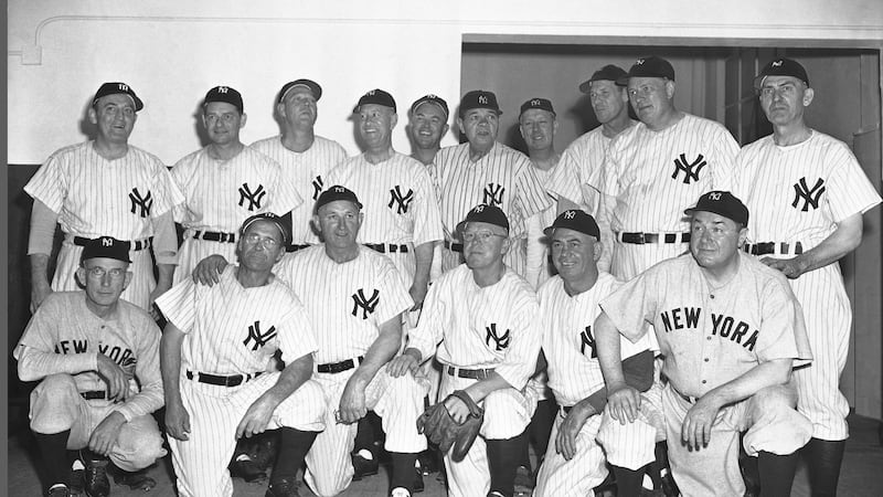 FILE — Babe Ruth, rear fifth from right, and members of the 1923 New York Yankees gather in...