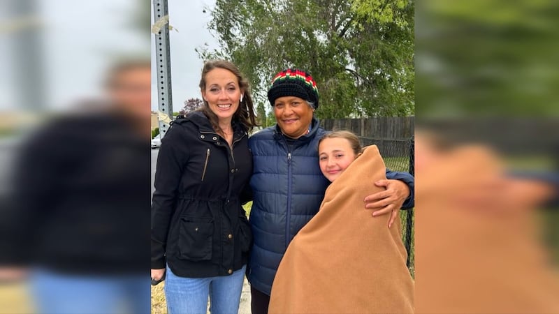 Crossing guard Ruta Pataialii (center) is being hailed as a hero for saving 11-year-old Alexis...